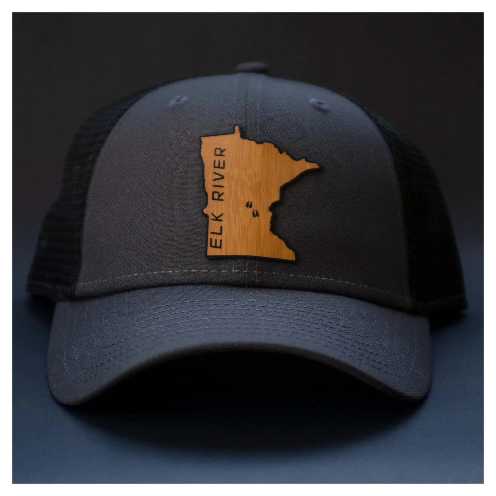 Black twill baseball cap with faux leather patch heat transferred Minnesota logo by Apex Transfers